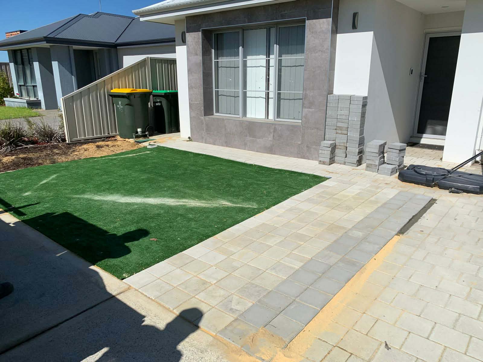 Front yard turf and paving installation in progress